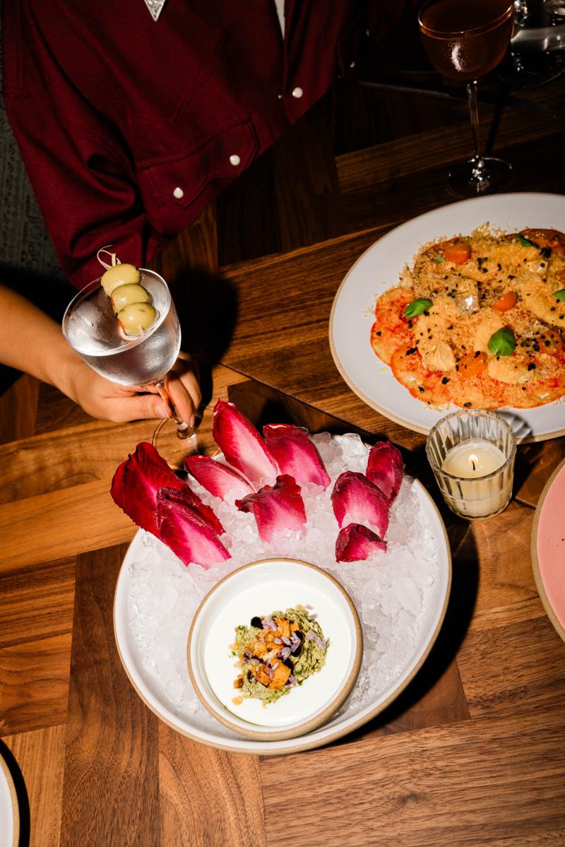Endive on crushed ice beside a martini