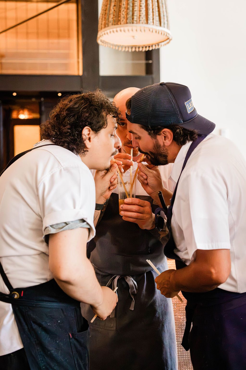 The team sharing a toast after service